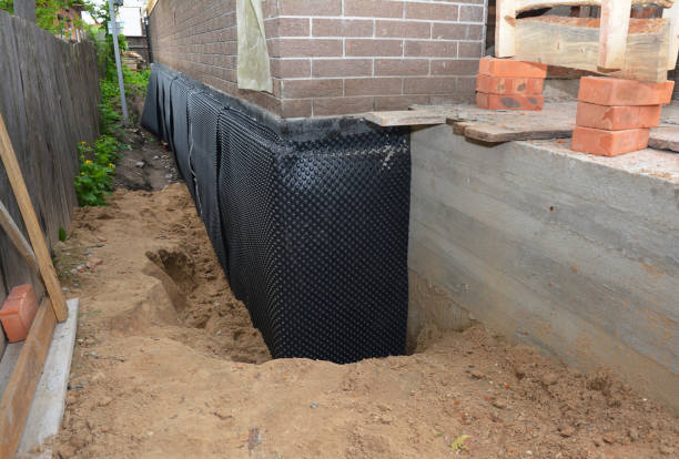 Happy homeowners after waterproofing job in Palmyra